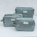 Set of three blue fabric bags with 'TAP' branding on a white background