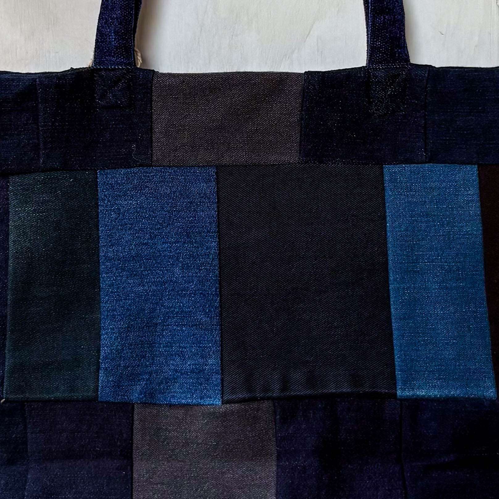 Black and blue checkered tote bag on a white background